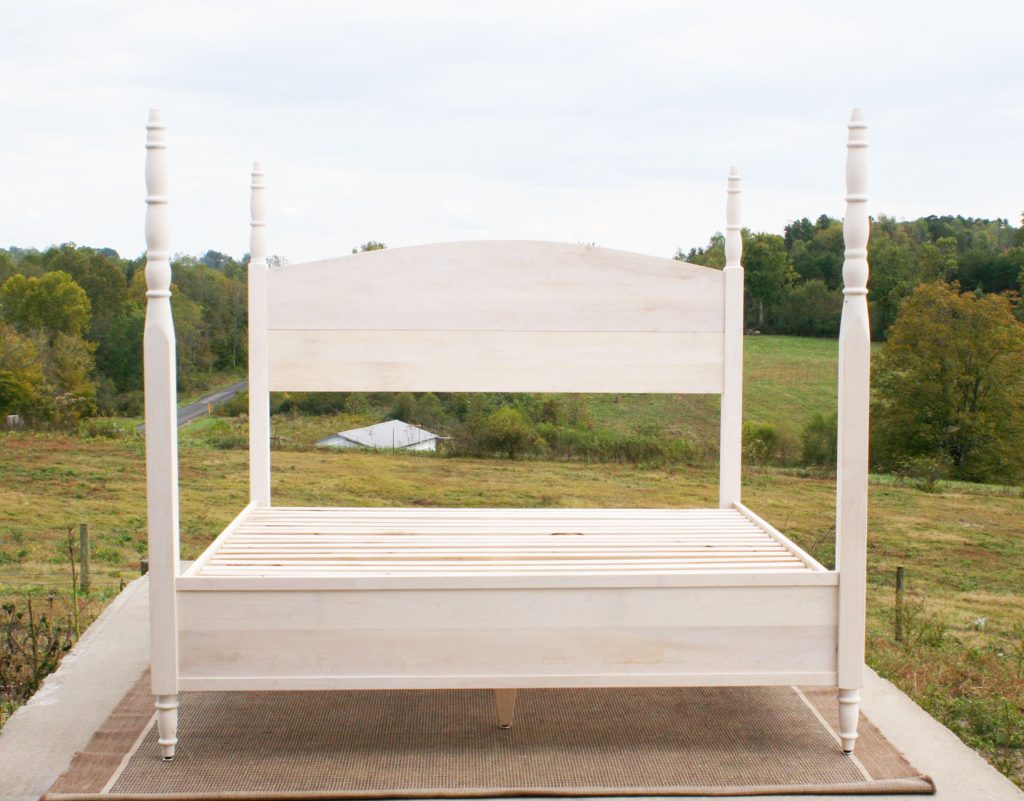 4 Poster bed with turned posts and arched headboard