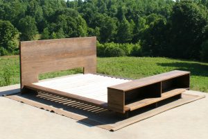 Low platform bed with bookcase foot-end