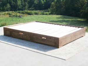 angled view natural Low profile storage bed with 4 drawers
