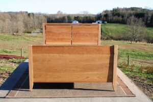 Platform Bed with 4 drawers, 2 cubbies, split-panel headboard and solid footboard front view