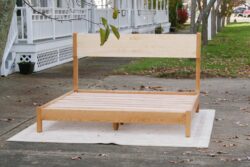 Platform Bed with tall headboard and curved posts front view