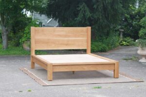 Platform Bed with thick posts and vertical headboard front view
