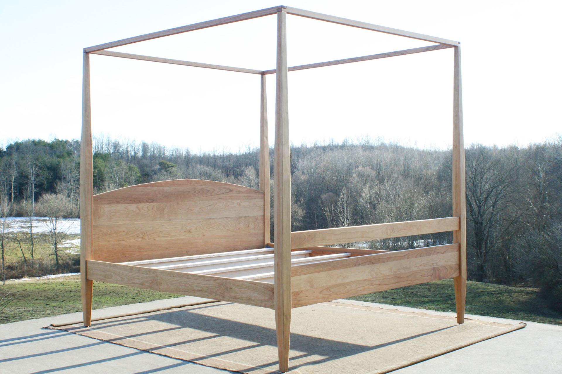 Canopy bed with tall legs and arched headboard cbrnv5