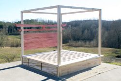 angled view Torii Gate bed with 6 drawers and square canopy
