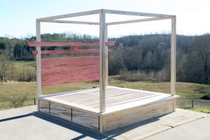 angled view Torii Gate bed with 6 drawers and square canopy