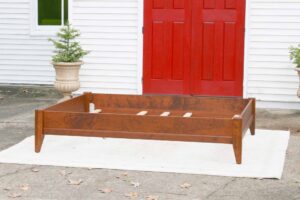 solid wood bed with trim side view