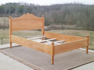 classic four poster bed front view natural hardwood