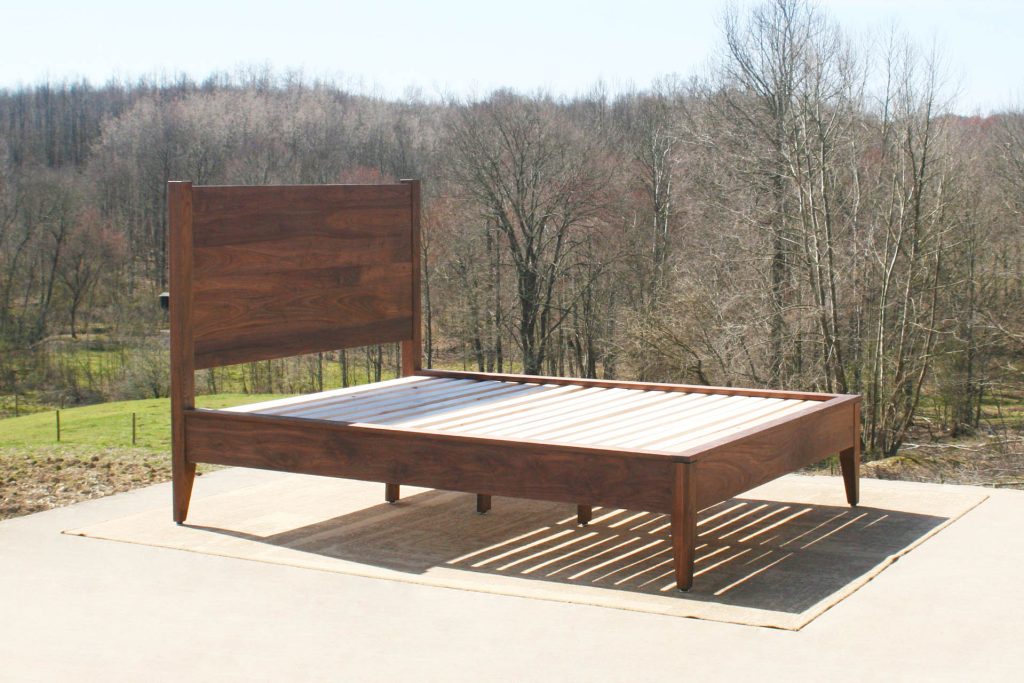 natural walnut platform bed with curved headboard