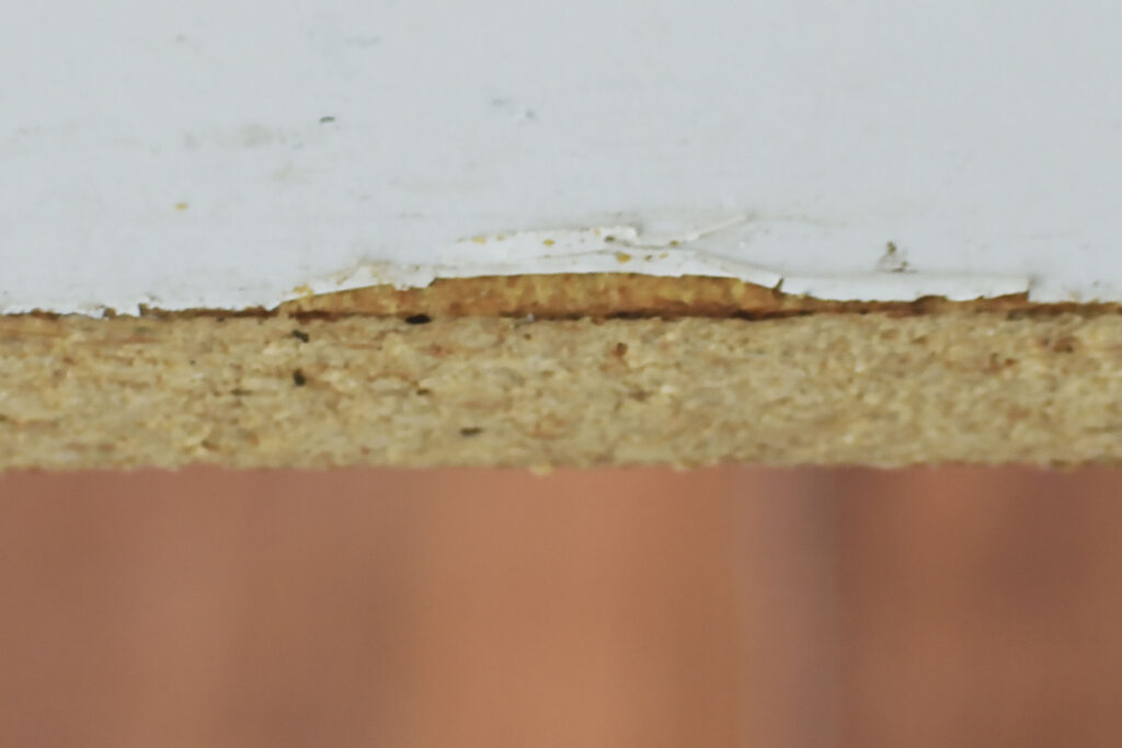 veneer away from peeling particle board