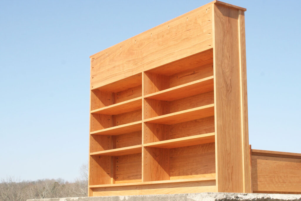 bed with storage on the back of the headboard