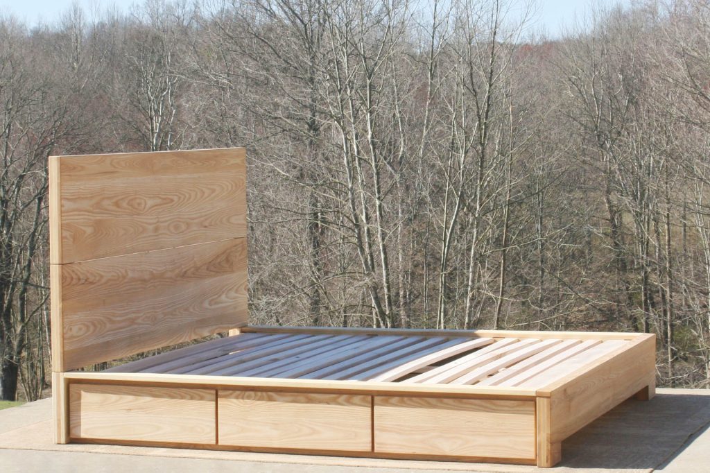 angled view natural wood Low Storage Bed with Beveled Overlays