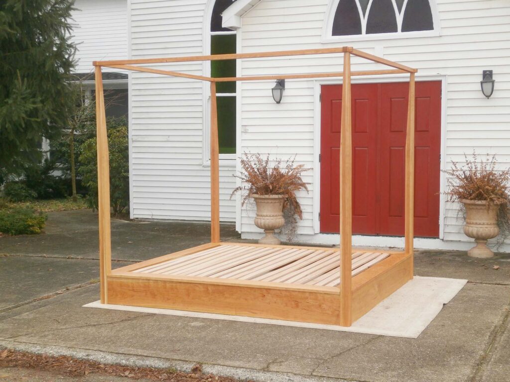 Platform Bed with a large rail canopy and tapered posts side view